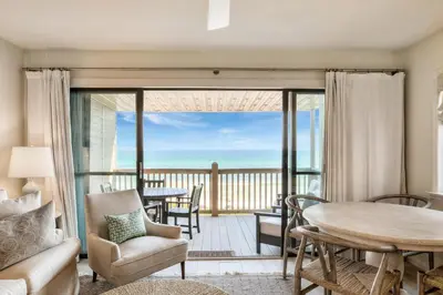 a living room with a view of the ocean at Seamist #8 in Seacrest