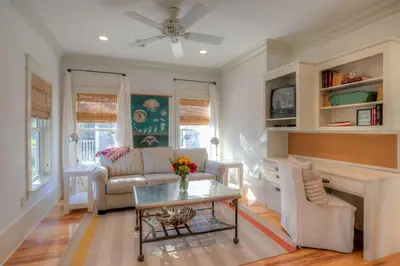 a living room with a couch and a table at Out of Bounds in Santa Rosa Beach