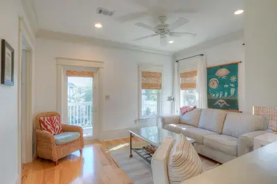 a living room with a couch and a table at Out of Bounds in Santa Rosa Beach