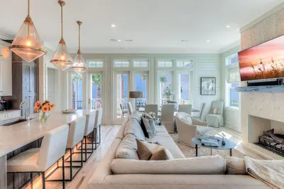 a living room with a couch and a fireplace at Patience Cottage in Santa Rosa Beach