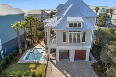 an aerial view of a house with a swimming pool at Patience Cottage in Santa Rosa Beach