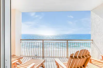 a balcony with chairs and a view of the ocean at High Pointe 32W in Rosemary Beach
