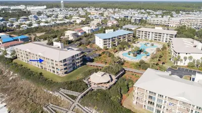 an aerial view of an apartment complex with a resort at High Pointe 32W in Rosemary Beach