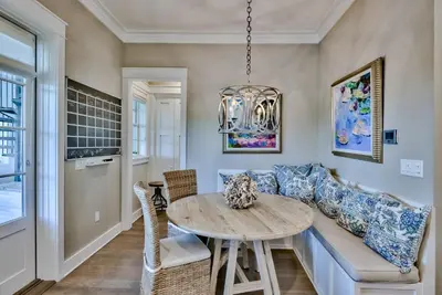 a living room with a couch and a table at Seaspell Sands in Santa Rosa Beach