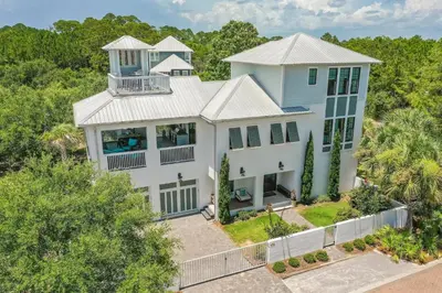 an aerial view of a large white house at Seaspell Sands in Santa Rosa Beach