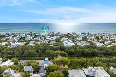an aerial view of a town with houses and the ocean at Highland Cottage in Rosemary Beach