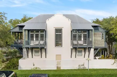 a house with a black roof at Highland Cottage in Rosemary Beach