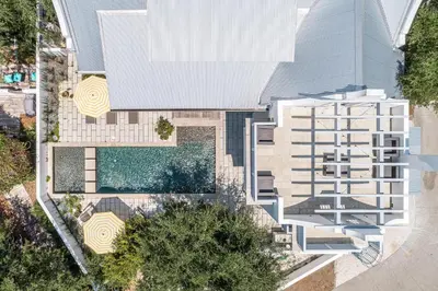 an overhead view of a house with a swimming pool at Carefree Cottage in Rosemary Beach
