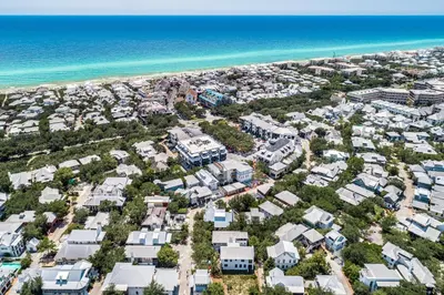 an aerial view of a beach with houses and the ocean at Carefree Cottage in Rosemary Beach