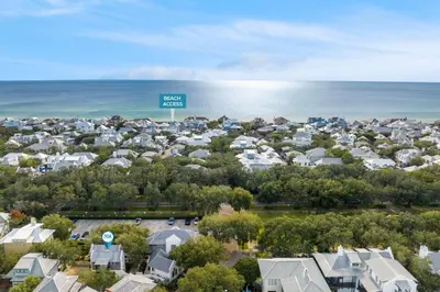 an aerial view of a neighborhood with houses and the ocean at Highland Carriage House in Rosemary Beach