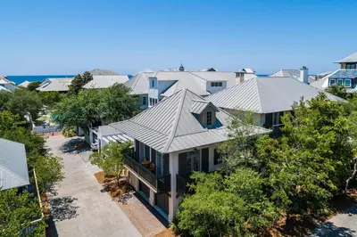 an aerial view of a house with a roof at Belize Carriage House in Rosemary Beach