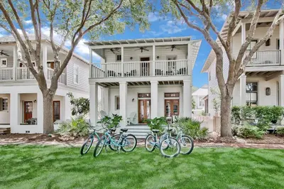 a group of bikes parked in front of a house at McKenzie Cottage in Rosemary Beach
