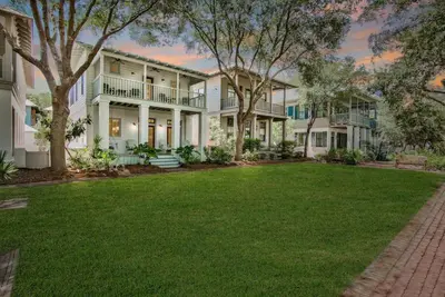 a large house with a lawn in front of it at McKenzie Cottage in Rosemary Beach