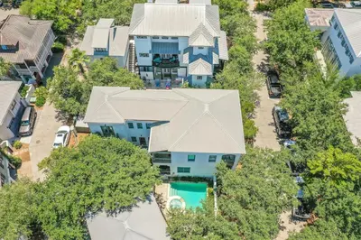 an overhead view of a blue house with a pool at Sylvia's Cottage in Rosemary Beach