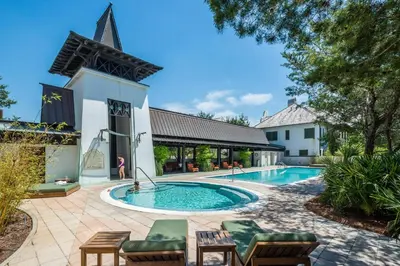 a swimming pool in front of a building at Savannah 1E in Rosemary Beach