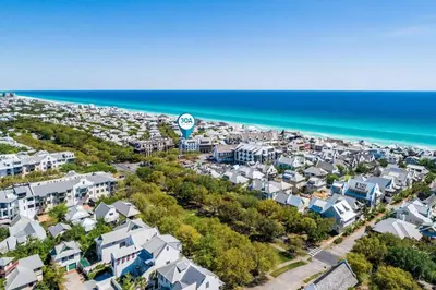 an aerial view of a town with houses and the ocean at Savannah 1E in Rosemary Beach