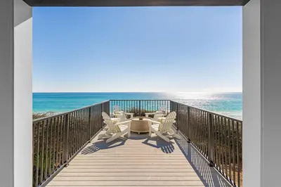 a view of the ocean from the balcony of a beach house at Wilder Dreams in Seacrest