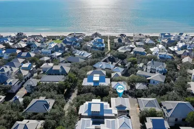 an aerial view of a city with houses and the ocean at Deauville Carriage House in Rosemary Beach