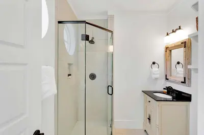 a bathroom with a shower and a sink at Flip Flop Dreams in Seacrest