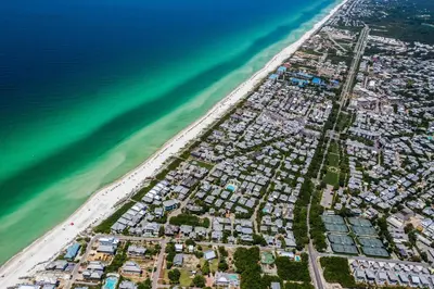 an aerial view of a beach next to the ocean at Benoit Cottage in Rosemary Beach