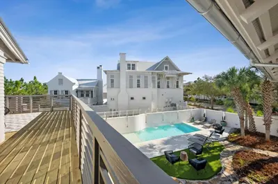 a view from the balcony of a house with a swimming pool at Kingston Beach Club in Rosemary Beach