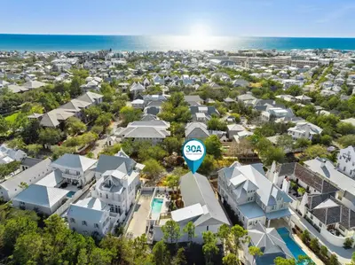 an aerial view of a neighborhood with houses and the ocean at Kingston Beach Club in Rosemary Beach