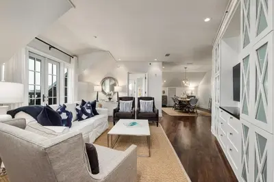 a living room with a couch and a table at Blue Oak in Rosemary Beach