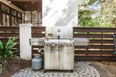a stainless steel barbecue grill sitting on a patio at Benoit Carriage House in Rosemary Beach
