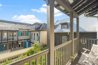 a view from the balcony of a house at Terra Casa Cottage & Carriage House in Rosemary Beach
