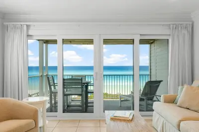 a living room with a view of the ocean at Seamist #5 in Seacrest