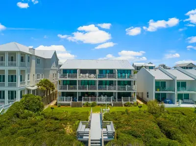 an aerial view of a large building with benches in front at Seamist #5 in Seacrest