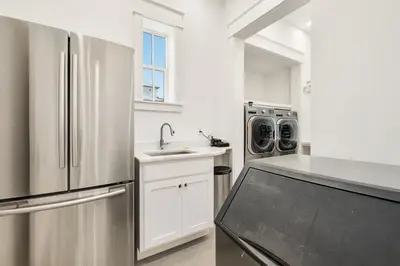 a kitchen with a stainless steel refrigerator and a sink at 98 Sandy Shores Ct in Seacrest
