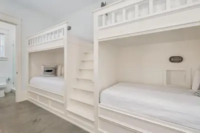 two white bunk beds in a white bedroom at 98 Sandy Shores Ct in Seacrest