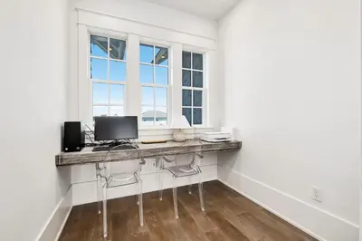 a room with a desk with a computer and a window at 98 Sandy Shores Ct in Seacrest