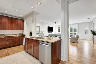 a kitchen with a sink and a counter top at Rose at Mercado in Rosemary Beach