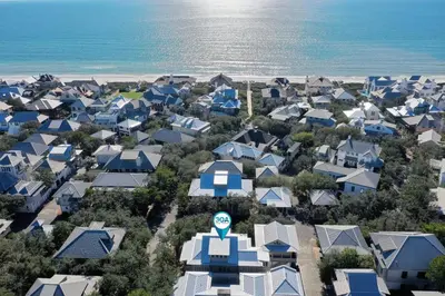 an aerial view of a city with houses and the ocean at Deauville Cottage in Rosemary Beach