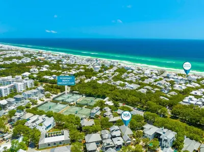 an aerial view of a beach with houses and condos at R&B Cottage & Carriage House in Rosemary Beach