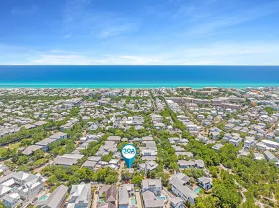 an aerial view of a city with a hot air balloon at Butterfly Carriage House in Rosemary Beach