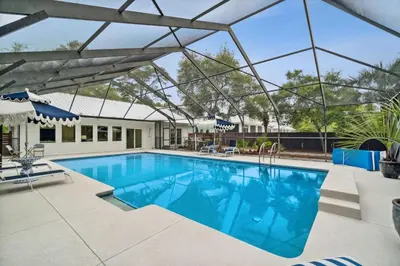 a swimming pool with a large glass ceiling at Moon Tide in Seacrest