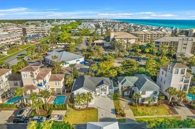 an aerial view of a residential neighborhood with houses and the ocean at Nashvilla in Seacrest