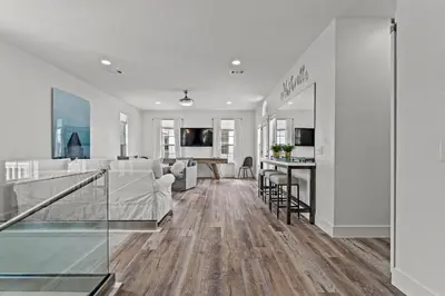 a living room with a kitchen and a dining room at Nashvilla in Seacrest