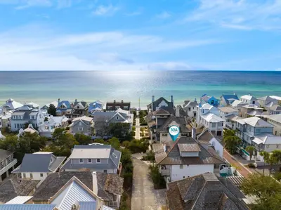 an aerial view of a town with houses and the ocean at Water Cottage and Carriage House in Rosemary Beach