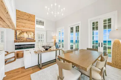 a dining room with a table and chairs at Atwoods Cottage & Carriage House in Rosemary Beach