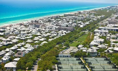an aerial view of a city with houses and the ocean at Hammock Carriage House in Rosemary Beach