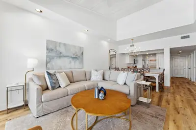 a living room with a couch and a table at High Pointe 44W in Seacrest