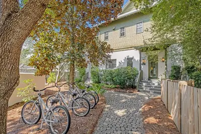a group of bikes parked in front of a house at Villa Rose Cottage in Rosemary Beach