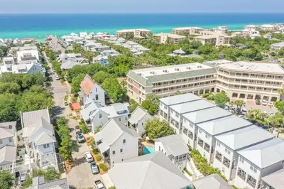 an aerial view of a city with buildings and the ocean at Southern Serenity Cottage in Rosemary Beach