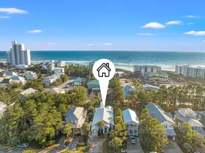 an aerial view of a city with a house and the ocean at Sugar Sand Retreat – 3-Bed, 2-Bath Beach Getaway with Private Pool, Sleeps 8! in Santa Rosa Beach
