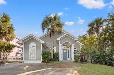a house with palm trees in front of it at Sugar Sand Retreat – 3-Bed, 2-Bath Beach Getaway with Private Pool, Sleeps 8! in Santa Rosa Beach