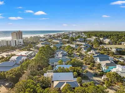 an aerial view of a small town with houses and the beach at Sugar Sand Retreat – 3-Bed, 2-Bath Beach Getaway with Private Pool, Sleeps 8! in Santa Rosa Beach